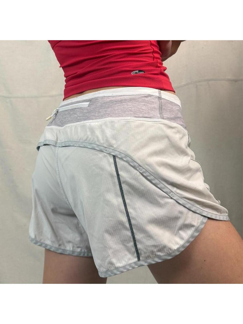 Classic Lululemon running shorts in white with reflective silver trim